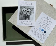 two wedding cards in a box on top of each other with the bride and groom's photo