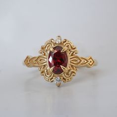 Read about our payment plans before proceeding. In the heart of this exquisite Faith ring, a crimson spinel nestles, a gem of nature's tender artistry. Embraced by delicate scroll-like motifs, each curve whispers tales of timeless elegance, bestowing upon it a vintage flair that dances with the echoes of ages past. Crafted by skilled hands, this ring is available in your choice of 14K and 18K yellow gold, rose gold, and white gold. All orders come in our Tippy Taste ring box. This ring is handmade and designed in NYC. 14K or 18K solid gold Natural red spinel, 6*4mm Natural round diamonds. SI clarity, GH color, 0.02ct total carat weight 1.5mm ring band ** Tippy Taste Heirloom Collection is made to order. Please allow 3-4 week turnaround time. Shipping:Domestic: Free shippingInternational: F Goth Engagement Rings Gold, Exquisite Red Ring With Rose Cut Diamonds, Gold Heirloom Ruby Ring With Gemstone Accents, Heirloom Gold Ruby Ring With Gemstone Accents, Heirloom Ruby Jewelry For Promise, Exquisite Oval Ruby Ring In 14k Gold, Fine Jewelry Red Ruby Ring With Intricate Design, Unique 14k Gold Ruby Ring For Wedding, Heirloom Ruby Jewelry With Gemstone Accents