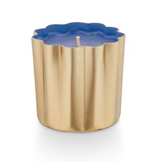 a gold and blue candle holder on a white background, with the lid closed up