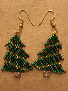 Christmas Tree, holiday themed earrings made with seed beads and nickel free earring. Stand out at your holiday party with custom created Christmas Tree earrings. Message me for custom orders. Christmas Beading, Tree Earrings, Christmas Tree Earrings, Earring Stand, Nickel Free Earrings, Earring Tree, Holiday Party, Holiday Parties, Custom Orders