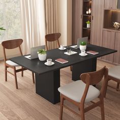 a dining table with four chairs around it