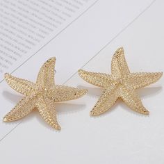 Large metallic starfish drop earrings available in lush gold color. Add to any outfit for a a fresh look! Details Item Type: Fashion Earrings Metal Type: Zinc Alloy Size: 6.7*6.0cm Back Finding: Push Back Silver Statement Earrings, Gold Statement Earrings, Earrings Metal, Gold Drop Earrings, Fun Earrings, Gold Gold, How Beautiful, Gold Material, Summer Looks