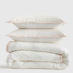 four pillows stacked on top of each other