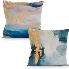 two pillows with gold leaf designs on them