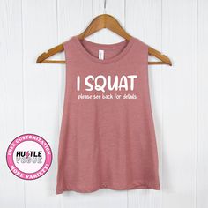 Add a touch of humor to your workout with our Funny Squat Shirt. With the phrase "I Squat," turn around for the amusing details. This funny workout tee is a perfect addition to your workout outfit.  ---------------------------------------------------------- 𝐌𝐨𝐫𝐞 𝐜𝐨𝐥𝐨𝐫 & 𝐒𝐡𝐢𝐫𝐭 𝐨𝐩𝐭𝐢𝐨𝐧𝐬 ➤ https://www.etsy.com/shop/HustleVogue 𝐍𝐎𝐓𝐄: Prior to placing your order, please verify the color availability for each shirt type displayed on the listing image. -------------------------- Sporty T-shirt With Funny Text For Sports, Funny Text Crew Neck Gym Top, Funny Text Crew Neck Top For Gym, Sporty Yoga T-shirt With Letter Print, Short Sleeve Gym Top With Funny Text, Funny Text Short Sleeve Gym Tops, Sporty Tops With Funny Text For Workout, Sporty Workout Tops With Funny Text, Funny Gym Tops With Crew Neck