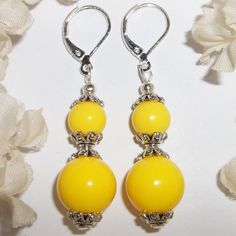 This Brand New With Tags Beaded Earring Set Was Handmade By Me With Yellow Acrylic Beads. The Pair Also Have Silver Toned Costume Jewelry Beads That Were Antiqued In Black. They Dangle & Drop From 925 Sterling Silver Lever Backs For Women's Pierced Ears. Measure 2 Inches Tall & 1/2 Inch Wide. Each Single Earring Weighs 2.7 Grams. Perfect Fashion Accessory For When You Need A Bold Pop Of Color. You Will Look Amazing Wearing Them. Grab Them Before Someone Else Does Leverback Xl Statement Bright L Elegant Yellow Earrings For Summer, Elegant Yellow Summer Earrings, Yellow Jewelry With Ear Wire For Party, Party Jewelry With Yellow Ear Wire, Elegant Yellow Summer Jewelry, Yellow Jewelry With Dangling Beads For Party, Yellow Dangling Beads Earrings For Summer, Yellow Beaded Drop Earrings, Yellow Beaded Earrings With Ear Wire For Summer