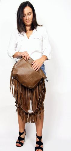 Western Fringe hobo bag - brown leather bohemian  bag, Western shoulder bag, Bohemian Women bag, Western fringe purseThis crossbody bag is the perfect size to carry your daily essentials in style! It is made from high quality leather.This leather bag is a perfect everyday bag! There is a lot of space and you can put there everything in your everyday life.* Top zipper closure* Outer slip pocket on the back* Includes internal pockets for mobile phone and other small items.Important note:The flap o Fringe Pouch Bag For Everyday Use, Travel Fringe Pouch Shoulder Bag, Leather Fringe Clutch Bag, Travel Shoulder Bag With Fringe And Pouch Shape, Travel Shoulder Bag With Fringe In Pouch Shape, Brown Soft Leather Satchel Clutch, Brown Tassel Bags For Daily Use, Travel Clutch Bag With Tassels, Everyday Clutch Bag With Tassels