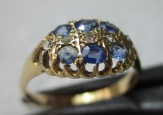 Quality early Edwardian 18ct solid gold diamond and sapphire gemstone ring. The head of the ring is marquise shaped, size 10.0mm{North to South} x 12.0mm{East to West} and is encrusted with rows of light blue sapphire gemstones and diamond gemstone chips, sandwiched between. All of the gemstones are in top condition and exposed to the ring's reverse side to allow the light to shine through to make them glow, also for easy cleaning access. The shank is straight and displays a full striking Birmin Light Blue Sapphire, Sapphire Gemstone, Precious Gemstones, Diamond Gemstone, Gemstone Ring, Rings Statement, Easy Cleaning, Blue Sapphire, Statement Rings