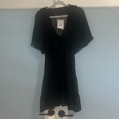 New With Tags Black V-neck Dress With Ruffles, Black A-line Beach Dress, Black V-neck Short Sleeve Dress For Summer, Black V-neck Short Sleeve Summer Dress, Black V-neck Short Sleeve Dress For Day Out, Black Short Sleeve V-neck Dress For Day Out, Casual Black Short Sleeve V-neck Dress, Black Knee-length Sundress Mini Dress, Black Casual V-neck Dress With Short Sleeves