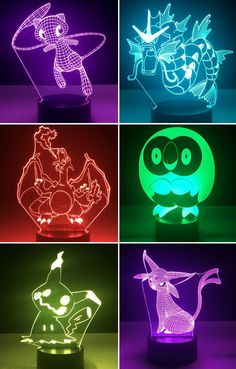 four different colored lights that are in the shape of animals and bats, with one light turned on