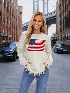 Stand out in style with our American Flag Relaxed Knit Sweater! This quirky and fun sweater features the iconic stars and stripes design, adding a playful touch to your look. Stay comfortable and show off your patriotic side with this cozy and unique sweater. Size Guide: Model is 5’7” tall, and has a 32.7” bust, 24.6”waist, & 36.2” hips. She is wearing a S / US 4 / AU 8. This sweater is true to size. Feature: Ripped crew neckline. Long sleeves. Ripped knit fabrication details. Not lined. Oversized Relaxed Fit. Material: 100% Acrylic. Care Instructions: Machine wash / Cold hand wash. Americana Long Sleeve Sweater For Fall, Long Sleeve Americana Sweater For Fall, Fall Americana Long Sleeve Sweater, Fall Flag Print Crew Neck Sweater, Fall Flag Print Long Sleeve Sweater, Casual Crew Neck Sweater With Star Print, Long Sleeve Flag Print Sweater For Fall, Fall Long Sleeve Flag Print Sweater, Knit Sweater With Star Print Long Sleeve