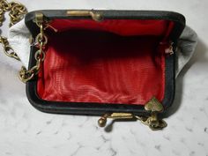 One of a Kind vintage white coin purse. This coin purse is really in perfect condition, which is rare. I added a piece of vintage jewelry to add a bit of charm. It would make the perfect gift. I T E M ∙ S P E C I F I C A T I O N S - PURSE SIZE: 4" x 3" frame opens about 2" and you could put something little inside - CHAIN LENGTH: 52" total length brass link chain, you can double the chain and make the necklace short C A R E ∙ T I P S: We don’t want your special moment to fade. To maintain the qu Vintage Evening Coin Purse With Card Slots, Vintage Compact Coin Purse For Gift, Retro Compact Coin Purse As Gift, Retro Compact Coin Purse For Gift, Compact Retro Coin Purse Gift, Gold Coin Purse With Coin Pocket As A Gift, Gold Coin Purse As Gift, Classic Gold Coin Purse As Gift, Handmade Vintage Compact Coin Purse