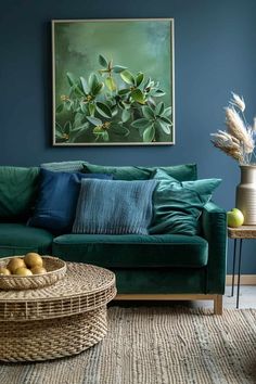 a living room with blue walls, green couch and wicker coffee table in front of it