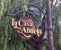 a wooden sign that says la casa de abuelo