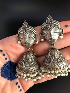 Extremely original, silver-colored metal earrings.A face of an Indian God Krishna with earwires - There are also earrings carved half-neck decorated with pearls The earrings are very light. Measurements Length 7 cm, width 3.5 cm. *Extremely Light weight. *Premium Quality. *Zinc Free *Allergic Free. *High Quality Metal. Wear can any outfit Handmade Silver Fusion Style Jhumkas, Handmade Silver Fusion Jhumkas, Traditional Silver Pearl Chandbali Earrings, Silver Fusion Style Drop Jhumkas, Silver Fusion Pearl Drop Earrings, Heavy Silver Bridal Drop Earrings, Silver Chandbali Pearl Drop Danglers, Silver Chandbali Fusion Pearl Earrings, Silver Pearl Drop Chandbali Earrings