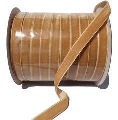 a roll of brown ribbon on a white background