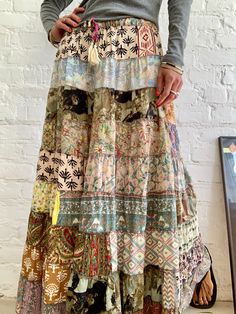 "Beautiful long boho style tiered skirt for summer time parties and daily wear  Super comfy, loose flared hem  Made patchwork of varieties fabric  MEAESURE free size Elastic waist 26-36} length 39\" MATERIAL *polyester Please visit also  https://www.etsy.com/shop/AltheaStores CARE INSTRUCTIONS  * Wash in warm water * Hand wash recommended * Hang to dry  IMPORTANT NOTE  * Please note that colour shown on your monitor may vary from the colour of the fabric, due to light. If you have any doubts ple Diy Boho Clothes, Patchwork Clothes, Boho Clothes, Diy Boho, Boho Skirts, Style Skirt, Summer Skirts, Tier Skirt, Summer Festival