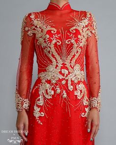 Custom made red Ao Dai with gold lace Materials: lace, sparkling pearl tulle, crystals Neckline: tall collar with beaded embellishment Long sleeves Closure: Zipper Chiffon pants Sweep train Red Wedding Gown With Sheer Bodice, Red Wedding Dress With Sheer Bodice, Red Gown With Sheer Bodice For Formal Occasions, Red Gown With Intricate Embroidery For Formal Occasions, Formal Red Gown With Intricate Embroidery, Elegant Red Gown With Intricate Embroidery, Red Long Sleeve Reception Dress, Red Long Sleeve Gown With Intricate Embroidery, Long Sleeve Red Gown With Intricate Embroidery