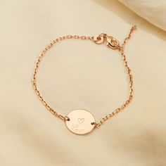 Our dainty Personalized Pastille Chain Bracelet features a delicate chain with a smooth disc and your hand-engraved initials or numbers, perfect for stacking with other designs or wearing alone.18K Champagne Gold Plated, 925 Sterling Silver or 18K Rose Gold PlatedChain length: 7, adjustable to 6.3Pastille charm: 0.6 x 0.6Hand-engraved in our Paris workshopSent with love in a complimentary gift boxAny slight variations in lettering depth, spacing and alignment from the examples shown are part of Dainty Rose Gold Name Bracelet In Sterling Silver, Engraved Rose Gold Sterling Silver Name Bracelet, Dainty Personalized Rose Gold Chain Bracelet, Dainty Engraved Name Bracelet, Dainty Rose Gold Name Bracelet With Initials, Personalized Dainty Name Bracelet, Personalized Dainty Gold Bracelet, Dainty Engraved Gold Bracelet, Dainty 14k Gold Chain Bracelet Engraved