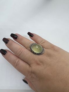 Elevate your jewelry collection with this stunning prehnite 925 silver ring. Expertly handcrafted, this adjustable ring boasts a natural prehnite stone measuring 14.3mm by 19mm, exuding a charming and timeless aesthetic. The delicate silver band adds a touch of elegance, making it the perfect accessory for any occasion. Upgrade your style game with this exquisite prehnite 925 silver ring. Timeless Aesthetic, 925 Silver Ring, 925 Silver Rings, Adjustable Ring, Adjustable Rings, Silver Band, Rings Statement, Statement Rings, Silver Ring