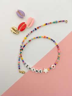 This fun and colourful personalized beaded necklace is a chic detail to your everyday style or as a gift to a loved one. Layer it up with more necklaces for a rich look or wear it alone for a clean and chic style. 🔸 CHOOSE YOUR LETTERS If you want a different word, please write this in the message to seller box when you check out. If you want a personalized necklace in different colours or other changes made, please send me a message. I'm happy to make a special piece for you. SPECIFICATIONS: M Cheap Red Beaded Necklace With Letter Beads, Cheap Blue Beaded Necklace With Letter Beads, Trendy Colorful Beaded Necklaces With Letter Beads, Trendy Colorful Beaded Necklace With Letter Beads, Trendy Custom Name Necklace For Everyday, Trendy Everyday Custom Name Necklace, Trendy Birthday Necklace With Letter Beads, Trendy Custom Name Jewelry With Round Beads, Customizable Trendy Necklaces For Birthday