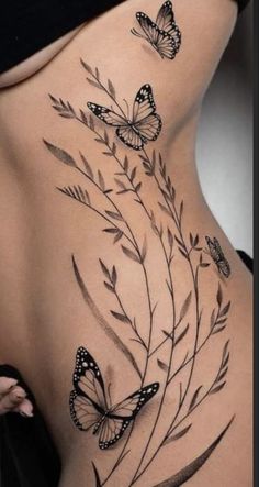 a woman's stomach with butterflies on it