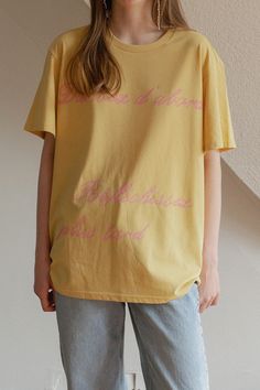 Looking for a comfortable and laid-back fit? Look no further than this Tired Girl T-Shirt! With a touch of vintage charm and playful lettering combinations, this shirt is perfect for warm days. Made with soft and durable 40 count cotton and woven with polyester, it has a refreshing feel and enhanced durability. Plus, it's been washed multiple times for that extra touch of softness. The double-layer fabric from Hotel 827 ensures a delicate and rich print of our protagonist, Jules, a relatable cha Spring Short Sleeve T-shirt With Lettering, Spring Letter Print Relaxed Fit T-shirt, Trendy Summer T-shirt With Lettering, Spring T-shirt With Lettering, Short Sleeve, Summer Short Sleeve T-shirt With Lettering, Summer Cotton Tops With Lettering, Spring T-shirt With Lettering, Cotton Graphic Tee With Lettering, Cotton Summer Tops With Lettering