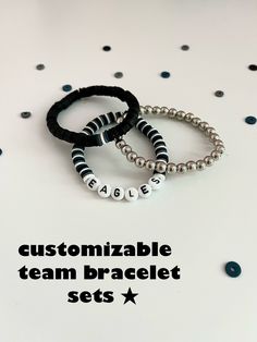 "These customizable sports team bracelets will lend a unique touch to any outfit and let everyone know who you are rooting for this year. With a sense of style and luck for any game, match, or competition, you won't regret purchasing! Examples/Instructions: For the team bracelet, (the one with the letters), you can type your order of colors and the name of the team you want on the bracelet.  Example: Colors 1,2,3,1,2,3, etc. \"Eagles\" For primary color bracelet, (the one with a main color and 3 Personalized White Bracelets For Football Season, Personalized School Spirit Jewelry For Game Day, Personalized White Wristband Team Spirit, School Spirit Personalized Jewelry For Game Day, Personalized Team-colored Bracelets For Team Spirit, Team Spirit Personalized Bracelets For Game Day, Adjustable Team Spirit Bracelets With Letter Beads, White Team Spirit Wristbands For Team Events, Adjustable Team Spirit Jewelry Gift