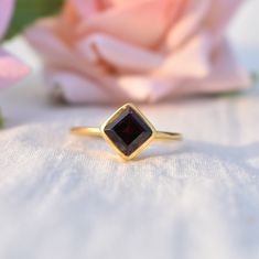 D E T A I L S - Stone: Natural Garnet Stone Shape: Cushion - Square Material: Sterling silver The fit: True to US ring size Finish: Smooth and Gold Plated to a high shine S H I P P I N G & P R O D U C T I O N - My current production time is 2-6 business days, which means after those days are up, your order ships! I make everything custom to order, by hand, but I promise you it's worth the wait! R U S H - M Y - O R D E R - If you're in a rush to get your pretty new pieces, please send me a me Promise Ring With Hallmarked Garnet Birthstone, Princess Cut Gemstone Rings For Gifts, Sapphire Open Ring With Vs Clarity For Gift, Vs Clarity Open Sapphire Ring For Gift, Princess Cut Sapphire Ring As Gift, Fine Jewelry Garnet Diamond Ring Gift, Garnet Solitaire Ring As Gift, Dainty Garnet Rings For Gift, Dainty Garnet Rings As Gift