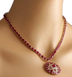 Stamped: 14K Yellow Gold Total Necklace Weight: 29.0 Grams Necklace Length: 17 Inches Necklace Width: N/A Gemstone Weight: Total Natural Center Ruby Weight is 1.85 Carat (Measures: 8.85x7.05 mm) Color: Red Gemstone Weight: Total Natural Side Ruby Weight is 52.00 Carat Color: Red Diamond Weight: Total Natural Diamond Weight is 1.50 Carat Quantity: 54 Color: F-G, Clarity: VS2-SI1 Face Measures: 33.50x33.70 mm Sku: [702598W] Formal Bridal Necklace In Yellow Gold With Gemstone, Formal Yellow Gold Bridal Necklace With Gemstone, Formal Round Diamond Necklace With Gemstones, Dazzling Round Diamond Necklace With Jewels, Diamond Necklace With Jewels, Dazzling Round Diamond Necklace, Formal Oval Necklace With 17 Jewels, Luxury Round Bridal Necklace With 17 Jewels, Formal Oval Necklaces With 17 Jewels