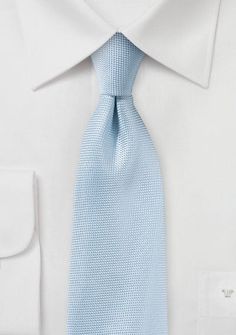 Though it initially referred to a much darker shade of blue, powder blue first appeared as a colour name in the 1890s and was later used to describe powdered cobalt glass. When shopping for suits, Its bluish-grey colour has a little bit of mystery to it because no one is exactly sure how or when the connotation of "powder blue" shifted to the lighter tint that it has today. This powder blue tie combines nicely with almost everything because it is a rather unassuming colour, but men’s wedding sui Elegant Blue Ties, Blue Elegant Suit And Tie Accessories For Formal Occasions, Elegant Blue Tie For Business, Elegant Blue Office Ties, Fitted Blue Office Ties, Classic Blue Ties For Formal Occasions, Elegant Blue Suit And Tie Accessories For Office, Elegant Light Blue Tie For Black Tie Events, Classic Blue Ties For Black Tie Events