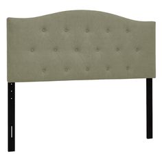 an upholstered headboard with black legs and buttons on the back of it