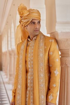 Orange peel raw silk sherwani with zardosi, french knots and aari embroidery. Comes with churidar, a kurta and a dupatta. - Aza Fashions Raw Silk Naqshi Bandhgala For Traditional Ceremonies, Raw Silk Bandhgala With Intricate Embroidery For Traditional Ceremonies, Ceremonial Raw Silk Sherwani With Naqshi, Raw Silk Sherwani For Traditional Ceremonies, Raw Silk Straight Kurta Sherwani For Traditional Ceremonies, Ceremonial Naqshi Sherwani In Raw Silk, Raw Silk Bandhgala With Resham Embroidery, Traditional Chikankari Embroidered Sherwani In Raw Silk, Raw Silk Bandhgala With Dupatta For Traditional Ceremonies