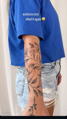 a person with a flower tattoo on their arm