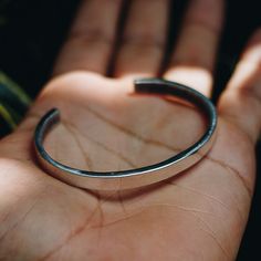 Minimalist 925 Sterling Silver cuff bracelet for men or women. A minimalistic silver cuff bracelet style adds the perfect touch dressed up or down. Available in Brass https://etsy.me/2FJXUS5 Bracelet Size Medium (Women's) Large (Men's) Every piece is handcrafted in Bali and made with Intention, Love, and Soul so that it can be felt by it's wearer and ultimately change our energy and lives in a positive way. Each with it's own story of insight and love, our pieces, like humans, are organic and as Silver Open Cuff Bracelet For Everyday, Everyday Silver Open Cuff Bracelet, Minimalist Open Cuff Bracelet, Adjustable Minimalist Sterling Silver Cuff Bracelet, Minimalist Sterling Silver Cuff Bracelet Gift, Minimalist Sterling Silver Cuff Bracelet, Minimalist Sterling Silver Open Cuff Bracelet, Classic Silver Cuff Bracelet For Everyday, Everyday Polished Cuff Bangle