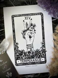 a card with an image of a hand holding flowers and the words xiv on it