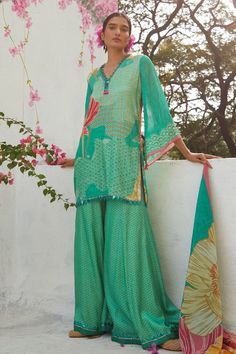 Aqua gajji satin kurta with floral print and sequins embroidery. Comes with sharara and an organza dupatta. - Aza Fashions Designer Turquoise Sets With Resham Embroidery, Unstitched Blue Bohemian Sets, Unstitched Bohemian Sets In Blue, Turquoise Sharara With Resham Embroidery For Eid, Blue Bohemian Unstitched Sets, Blue Bohemian Sets Unstitched, Traditional Unstitched Summer Lehenga, Green Sharara With Dupatta For Summer, Summer Festive Sharara With Sheer Dupatta