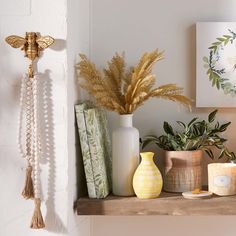 a shelf filled with vases and other decorative items