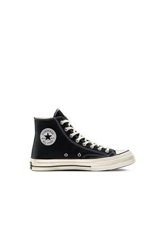 Converse Chuck 70 High Top Black More cushioning, tougher canvas, same versatility. The Chuck 70 High Top is built of the original 1970s design, with premium materials and an extraordinary attention to detail. Converse added an extra cushy insole for arch support and stability, and used wing tongue stitching on 12oz canvas for durability.  No reason not to wear them all day, every day.  - Canvas upper is lightweight and durable  - The timeless silhouette you know and love  - Rubber outsole for added traction  - Vintage license plate Black Chuck 70, Converse Chuck 70 High Top, Chuck 70 High Top, Black Chucks, Black Converse, Converse Chuck 70, Walker Shoes, Black High Tops, Chuck 70