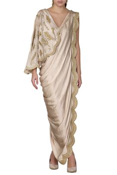 Gold saree dress with placement leaf work and scallop border.
Components:1
Bead and sequin embroidery
Neckline:V-shaped neckline
Sleeve Length:Sleeveless
Fabric:Satin
Color:Gold
One shoulder  drape
Deep v-shaped back - Aza Fashions Gowns Gold, Panelled Dress, Saree Gowns, Drape Sarees, Draping Fashion, Gown For Women, Saree Gown, Drape Saree, Gold Satin