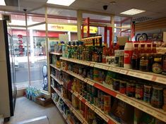 a store filled with lots of different types of condiments and sauces on shelves