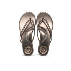 Indie Metallic Pewter Sandal Cushioned Single Toe Strap Flip Flops, Classic Flip Flops With Textured Footbed, Classic Open Toe Flip Flops With Cushioned Footbed, Classic Adjustable Synthetic Flip Flops, Classic Flip Flops With Textured Footbed And Toe Post, Sleek Flip Flops With Single Toe Strap For Beach, Classic Toe Post Flip Flops With Textured Footbed, Sleek Synthetic Flip Flops For Beach, Sleek Summer Beach Flip Flops