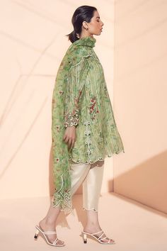 Transition effortlessly into spring with this tea-green khaddi silk printed kurta and printed organza dupatta with embroidery detailing. Paired with raw silk shalwar. Green Chanderi Salwar Kameez With Printed Motifs, Designer Green Salwar Kameez With Naqshi, Green Naqshi Dupatta For Festivals, Spring Kurta With Sheer Dupatta In Chanderi, Spring Chanderi Kurta With Sheer Dupatta, Spring Unstitched Suit With Dupatta And Straight Kurta, Designer Wear Green Salwar Kameez With Printed Motifs, Unstitched Suit With Dupatta For Spring, Traditional Organza Lawn Suit With Naqshi Detailing