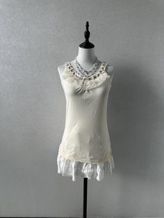 -Preloved, in great condition -Label size M, bust:79-87cm, length:61cm -Best fits uk6-8 dollete coquette balletcore kawaii harajuku dollcore fairy female jfashion grunge Fitted Cream Tank Top With Built-in Bra, Spring Cream Tank Top With Built-in Bra, White Ruffled Camisole With Spaghetti Straps, White Ruffled Camisole, Fitted Camisole With Lace Trim And Ruffled Straps, Fitted Lace Trim Camisole With Ruffled Straps, White Stretch Feminine Tank Top, Stretchy Feminine White Tank Top, Stretch Ruffles Camisole