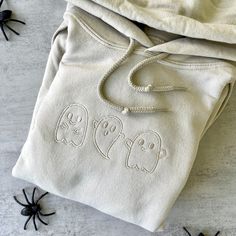 Diy Black Sweatshirt Ideas, Halloween Cotton Sweatshirt With Drawstring Hood, Hooded Embroidered Sweatshirt For Halloween, Halloween Embroidered Crew Neck Hoodie, Halloween Fleece Hoodie, Spooky Cotton Hoodie For Halloween, Spooky Halloween Cotton Hoodie, Halloween White Sweatshirt With Drawstring Hood, White Drawstring Hood Sweatshirt For Halloween