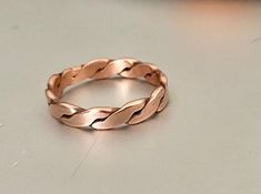 IF individually as ordered.  They are handmade, and not factory processed. This copper ring is 2 copper wires that I braid and flatten in my rolling mill. .   SIZE  16 gauge copper wire  1/4 inch wide PROCESS TIME The ring will be shipped within 1-3 days after ordering is completed.   SHIPPING  I use USPS first class mail service.  Each order will be mailed in a bubble lined envelope and in a gift box ready for gift giving.  It takes approximately 2-6 business days to arrive to destination.   RE Rose Gold Copper Ring For Anniversary, Rolling Mill, Fingernail Polish, Jewelry Board, Braided Ring, Bronze Ring, Copper Ring, Jewelry Boards, Copper Rings