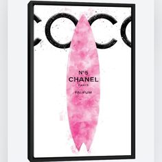 a pink surfboard with the words chanel on it in front of a white background