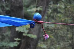 a blue kite is flying in the air