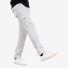 Treat your look to some casual vibes with XRAY Cargo Pants. This pair features a zip fly and button closure, side pockets, back pockets with a flap, dual cargo pockets at the thighs. White Parachute Pants With Hip Pockets For Streetwear, White Cargo Pants With Hip Pockets For Streetwear, Casual Cotton Cargo Pants With Zip Fly, White Cargo Pocket Trousers, White Streetwear Pants With Side Pockets, Casual White Pants With Side Pockets, Relaxed Fit Casual Cargo Pants With Zip Fly, White Cargo Bottoms, White Casual Cargo Style Bottoms