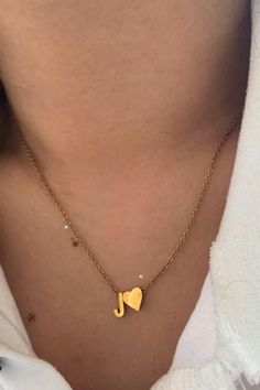 Follow your heart and stay true to yourself! This beautiful and dainty necklace is the perfect accessory to drape around your neck and layer with others. With a sturdy golden chain, you'll be able to keep your heart close. Customize the letter to represent your initial, a loved one's initials, or your own secret code!

>> Heart Initial Necklace: https://pinealvisionjewelry.com/products/heart-initial-necklace Dainty Initial Pendant Charm Necklace For Mother's Day, Dainty Mother's Day Initial Pendant Charm Necklace, Dainty Mother's Day Charm Necklace With Initial Pendant, Minimalist Initial Pendant Necklace With Heart Charm, Gold Initial Necklace With Heart Charm For Everyday, Everyday Gold Initial Necklace With Heart Charm, Gold Heart Pendant Name Necklace For Everyday, Initial Pendant Charm Necklaces For Mother's Day, Everyday Heart Pendant Necklace With Initials